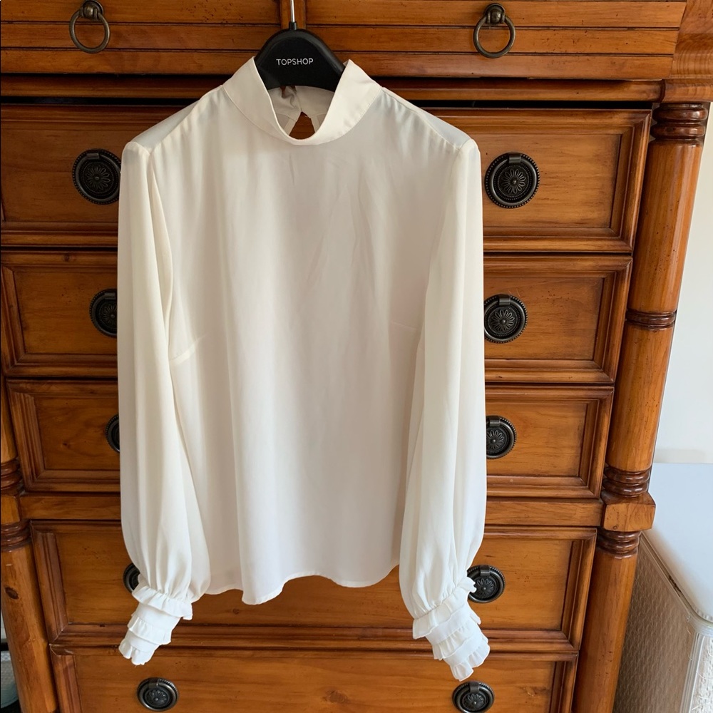 ModCloth sheer cream blouse with ruffle sleeves, keyhole back. Size small
